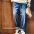 Men's 7.8oz washed denim jeans, loose fit, mid-rise, wide leg, blue.